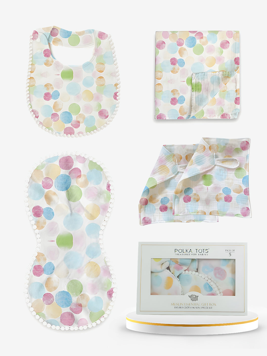 Baby product set with polka dot patterns including bib, burp cloth, and blanket.