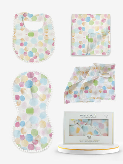 Baby product set with polka dot patterns including bib, burp cloth, and blanket.