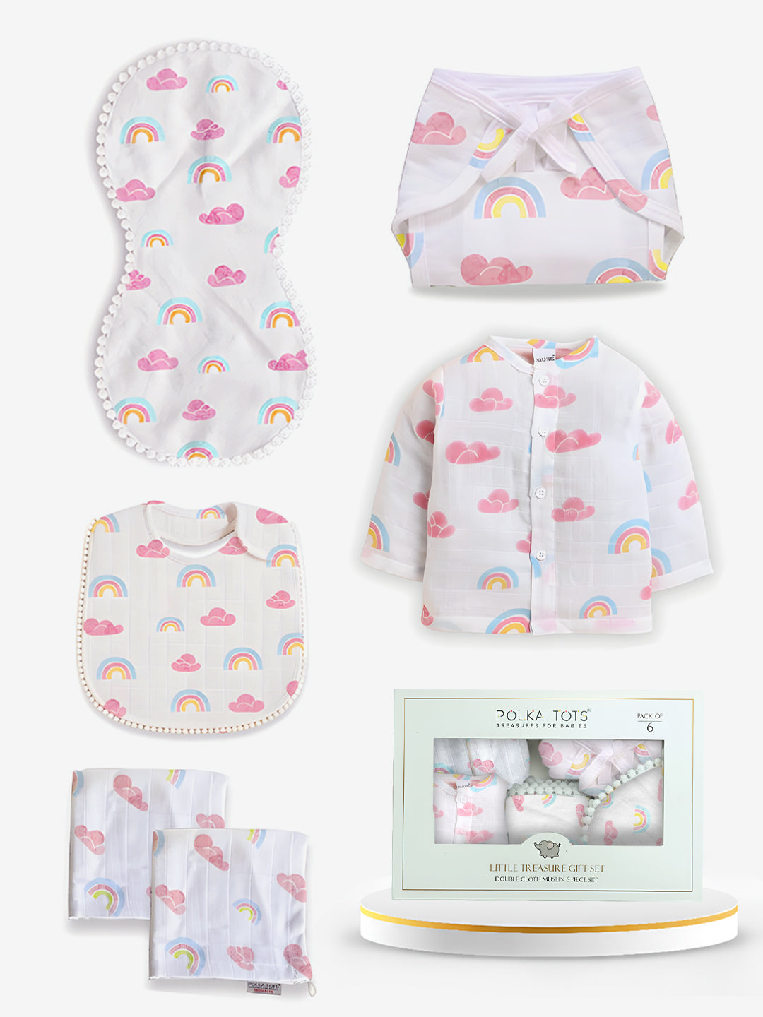 Baby product set with rainbow and cloud patterns on a white background