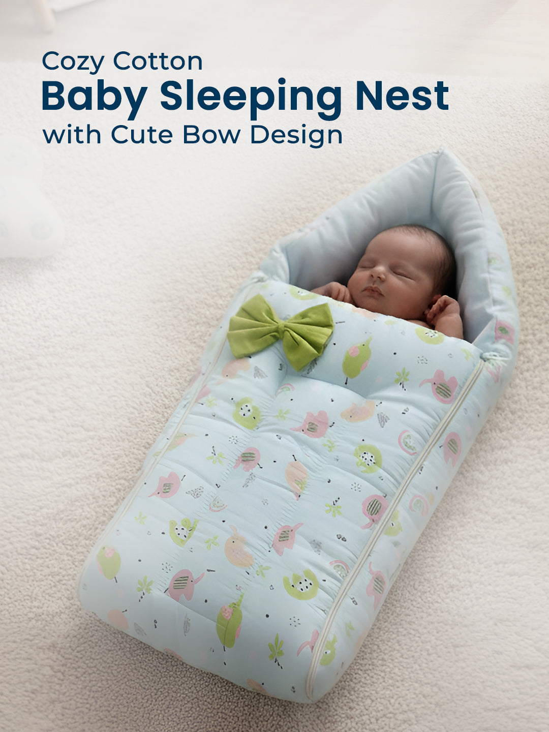 Baby sleeping in a cozy cotton baby sleeping nest with a green bow on a light background.