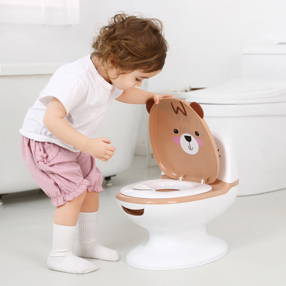 baby opening lid of polka tots potty training seat 