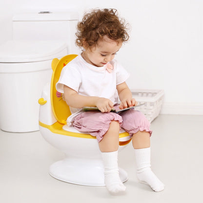 baby sitting on Potty Seat Reading Book